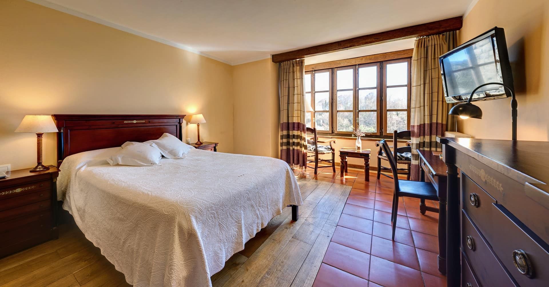 room with windows and mountain views in asturias