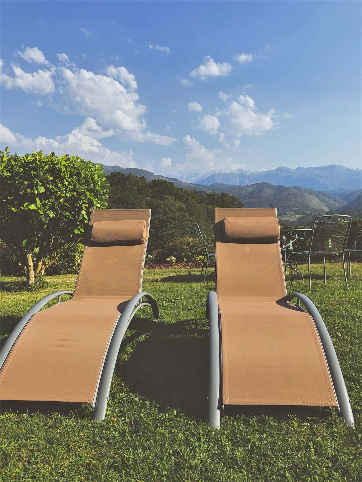 hotel with terraces deckchairs and green areas