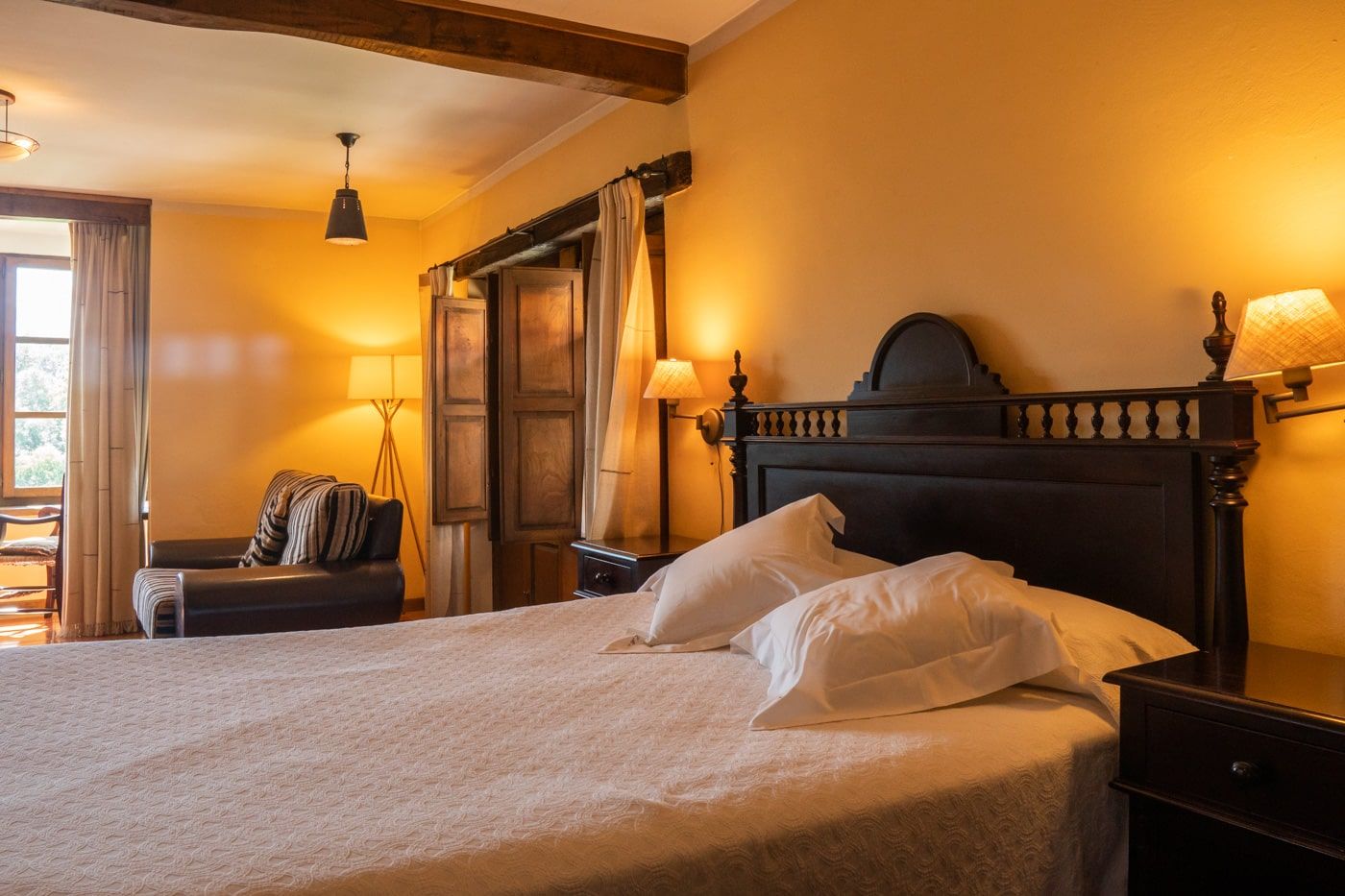 en suite room with fireplace and jacuzzi in the room in asturias